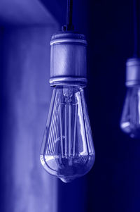 Close-up of light bulb hanging