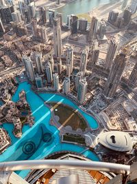 High angle view of swimming pool against buildings in city
