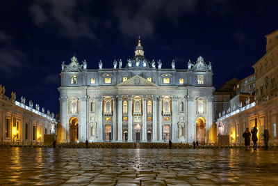 Low angle view of st peter basilica against sky at night