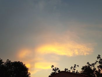 Low angle view of silhouette trees against sky during sunset