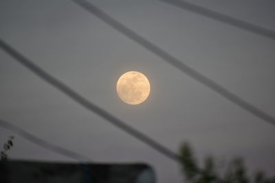 Low angle view of moon against clear sky at night
