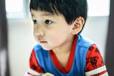 Close-up of cute girl at home