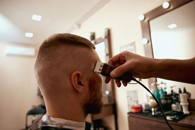 Side view of man working at clinic