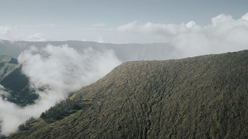 Scenic view of volcanic landscape against sky