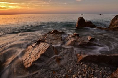 Scenic view of sea at sunset