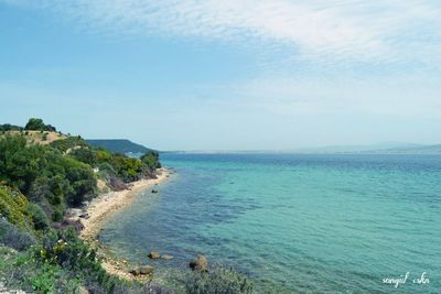 Scenic view of sea against blue sky