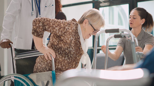 Rear view of woman sitting in train