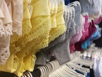 Close-up of colorful panties hanging for sale in store