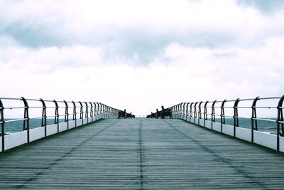 Footbridge against sky