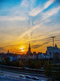 Buildings against sky during sunset