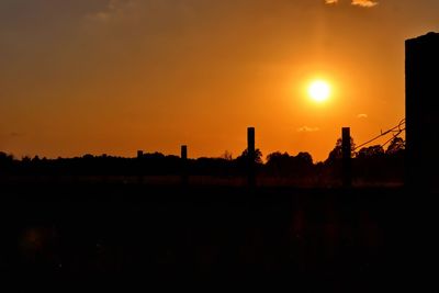 Silhouette landscape against sky during sunset