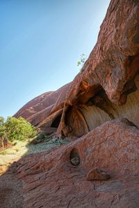 Rock formation on land against sky