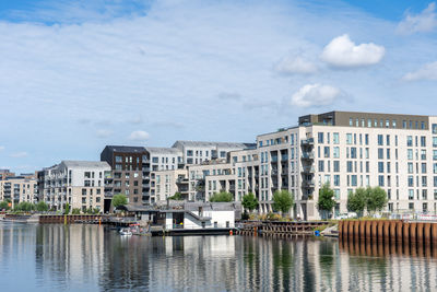 Boats in river against sky