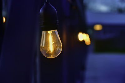 Close-up of illuminated light bulb