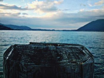 Scenic view of lake against cloudy sky