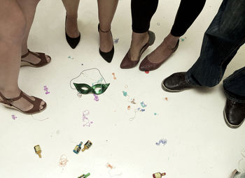 Friends standing together on floor in party