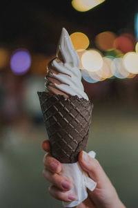 Midsection of person holding ice cream cone