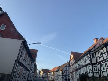 Low angle view of typical german fachwerkhaus buildings against blue sky