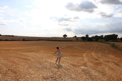 Woman standing in field