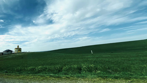 Scenic view of field against sky