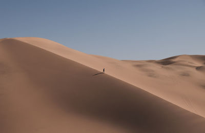 Scenic view of desert against clear sky