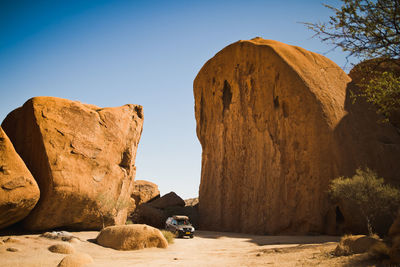 Rock formations in desert against clear sky