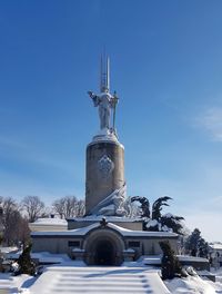 Statue of liberty against sky during winter