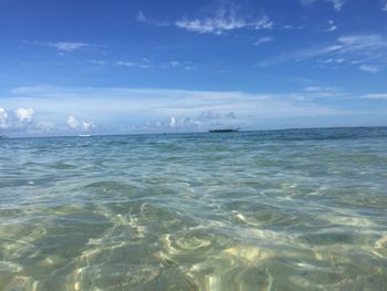 Scenic view of sea against cloudy sky