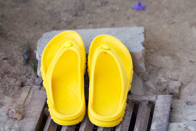 Close-up high angle view of yellow shoes