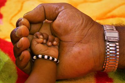 Low section of baby feet