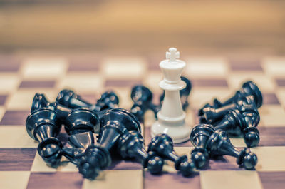 Close-up of chess pieces on table