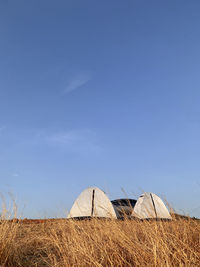 Low angle view of building against clear blue sky