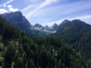 Scenic view of mountains against cloudy sky