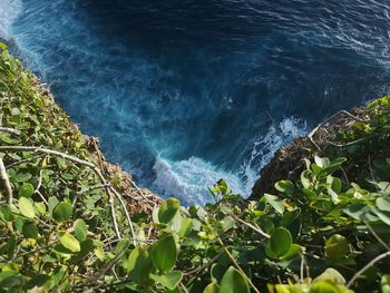 High angle view of rocks by sea