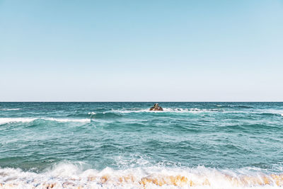 Scenic view of sea against clear sky