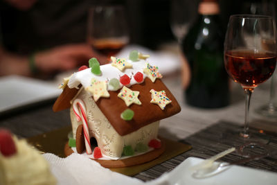 High angle view of house shape christmas cake on table