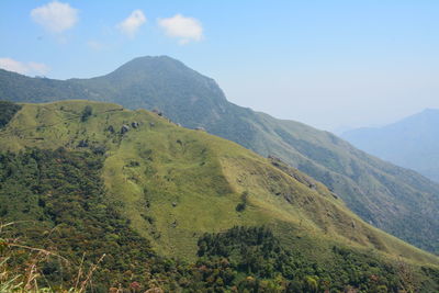 Green mountains against sky