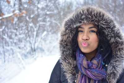 Portrait of beautiful young woman in winter