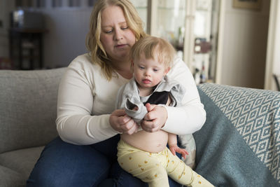 High angle view of mother and daughter at home