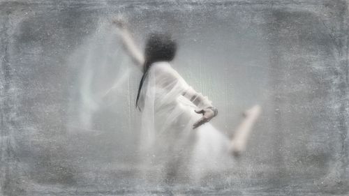 Close-up of woman standing in pond