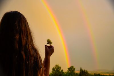 Scenic view of rainbow against sky during sunset