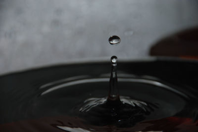Close-up of drop falling in water