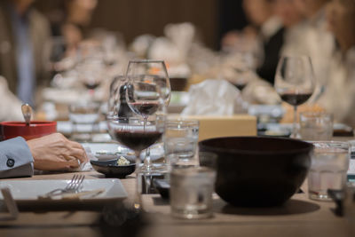 Glass of wine on the table for a company party in a fine dining restaurant at night