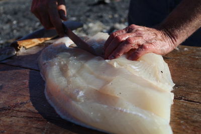 Close-up of person preparing food