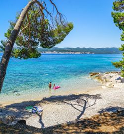 Scenic view of sea against clear blue sky