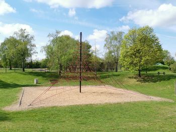 Trees on field against sky