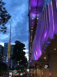 Low angle view of illuminated buildings at night