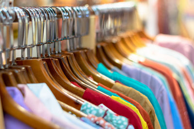 Close-up of textiles hanging in store for sale