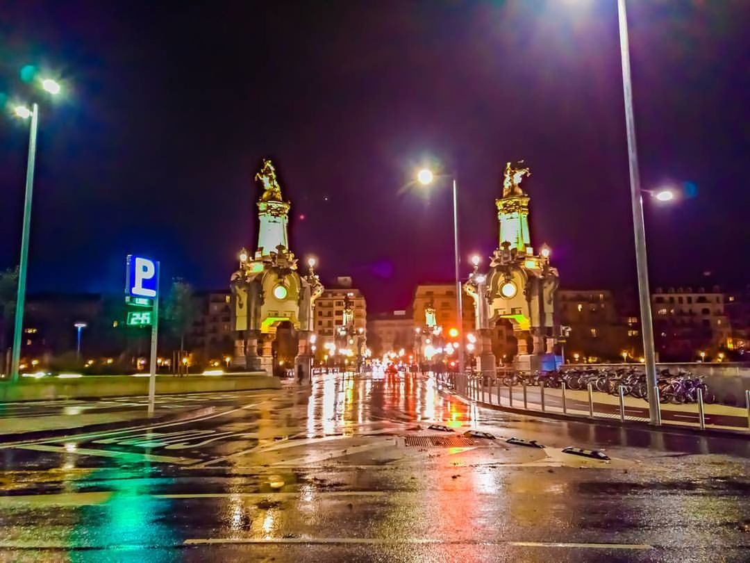 ILLUMINATED CITY STREET DURING RAINY SEASON