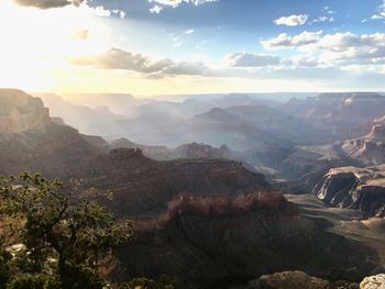 Scenic view of mountains against cloudy sky